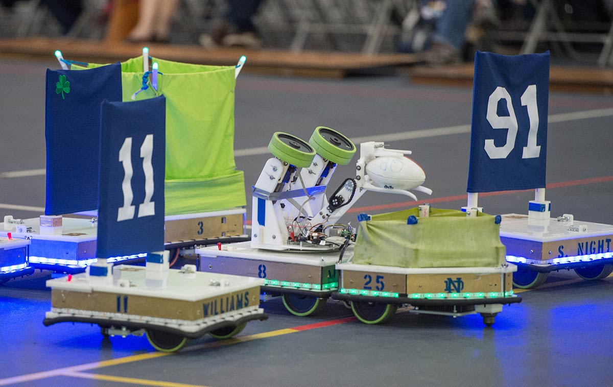 Close up of one robot passing the ball to another.