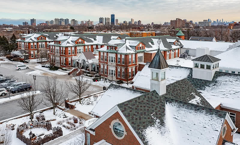 Elevated view of the Misericordia grounds on a snowy day.
