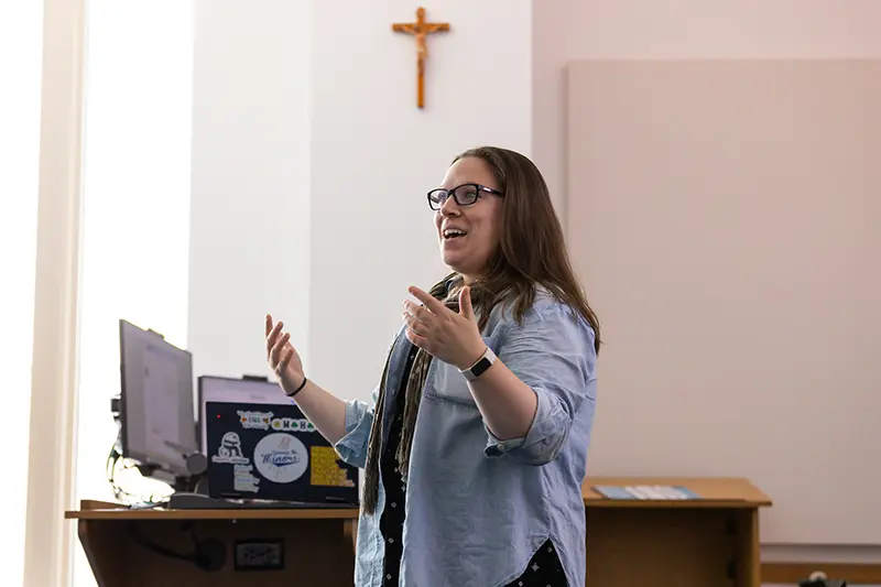 Kathrine Walden standing and speaking to class.