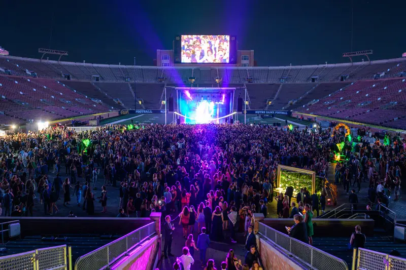 The field at Notre Dame stadium filled with students at the Inauguration ball.