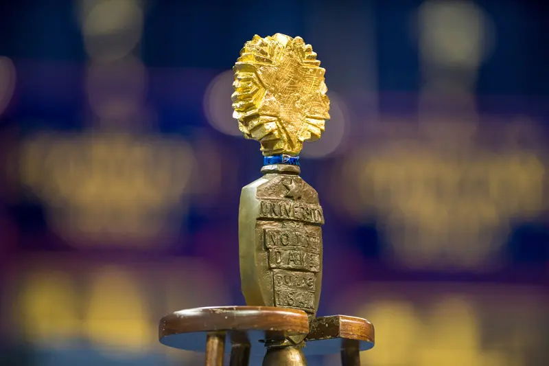 An old, hand-crafted gold star on a wooden staff, the mace is used in presidential ceremonies for The University.