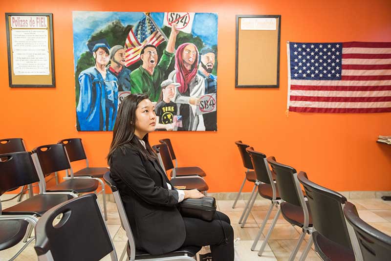 Student journalist Alex Park in the waiting room at FIEL, which provides a variety of immigration services in Houston, Texas.