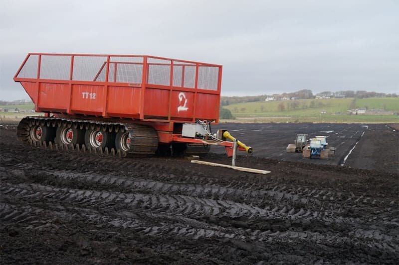 Large trailer used to transport large amounts of cut turf.