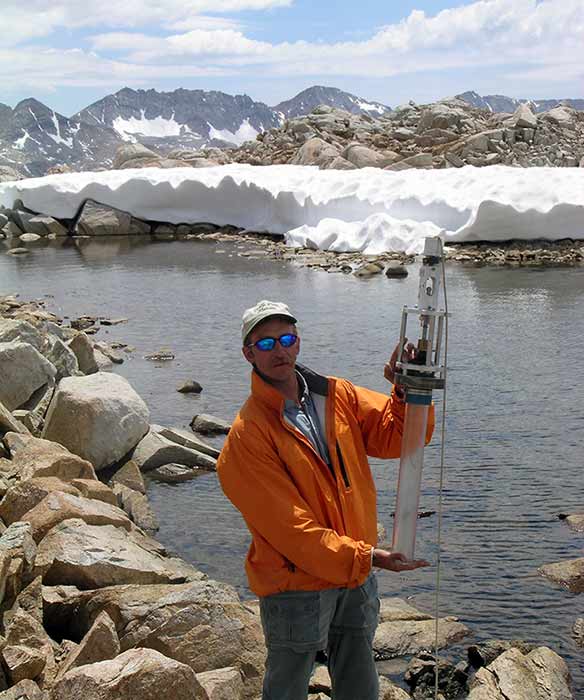 Michael Pfrender holding a surfacing core tube.