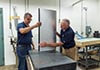 Mike Sanders and Eugene Heyse move the air foil.