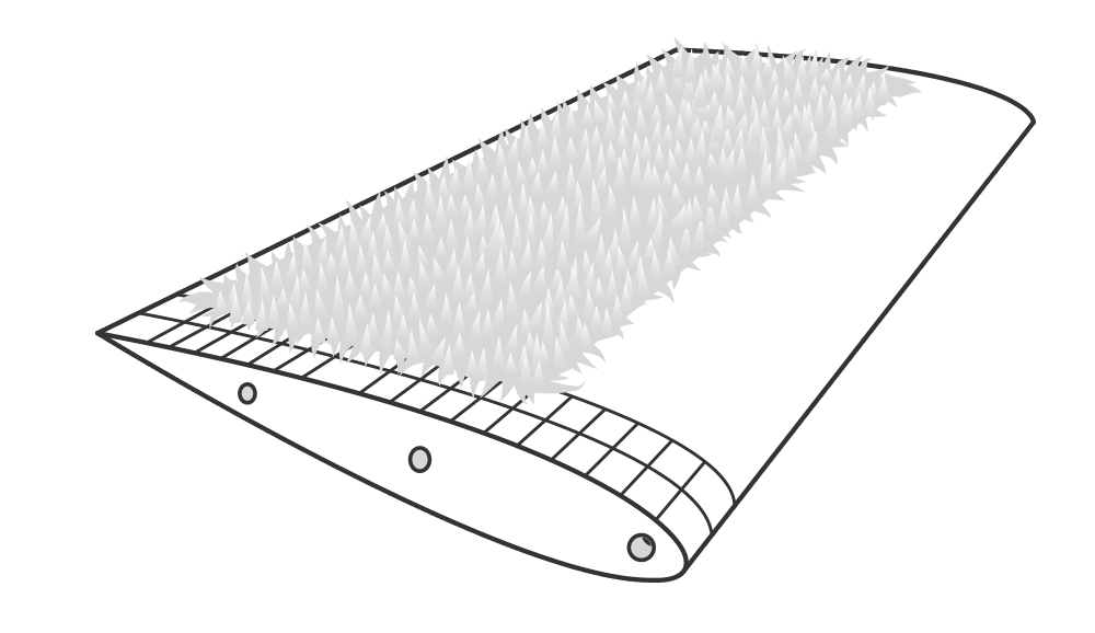 An airfoil with imitation hair follicles taped along the top of it.