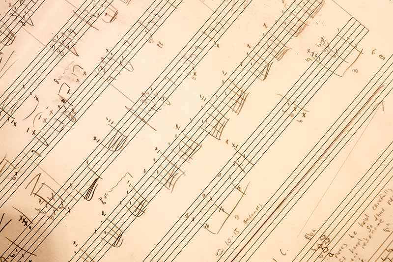 Hand written musical notes on a piece of paper.