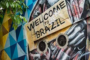 A wall with graffiti that reads Welcome to Real Brazil.