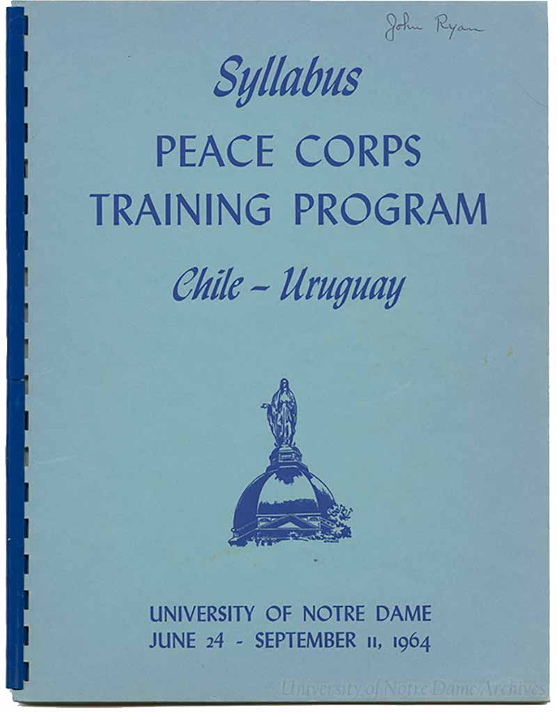 A blue binder syllabus that says “Syllabus, Peace Corps Training Program, Chile - Uruguay, University of Notre Dame June 24 - September 11, 1964.”