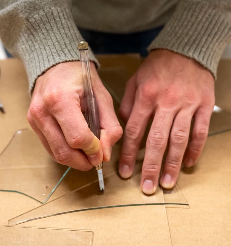 Students learn to cut glass in the Preservation Workshop during Stephen Hartley’s Painting with Light class.