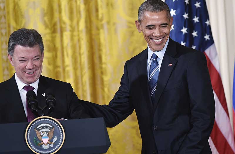 Colombia’s President Juan Manuel Santos (L) shares a laugh with US President Barack Obama during a reception in the East Room of the White House in Washington on February 4, 2016