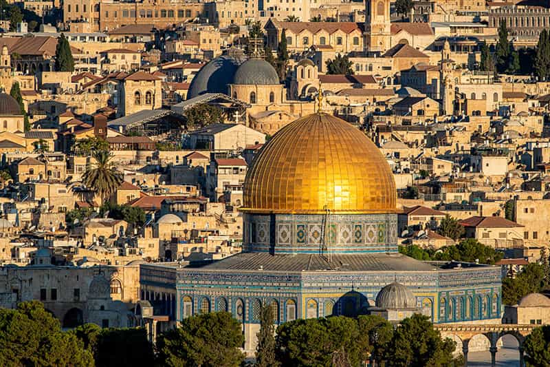Dome of the Rock mosque in the foreground and Church of the Holy Sepulchre in background.