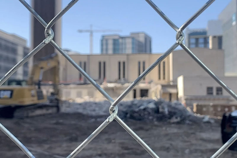 The St. Austin Parish construction site as viewed through a chain link fence