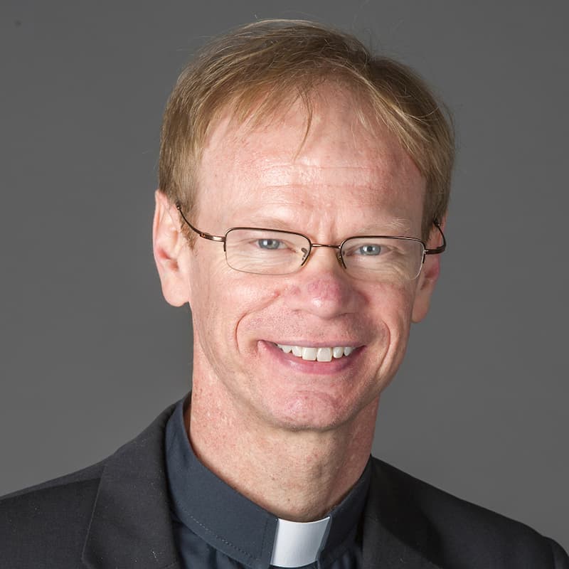 Headshot of Rev. Robert Dowd, C.S.C. taken by Barbara Johnston.