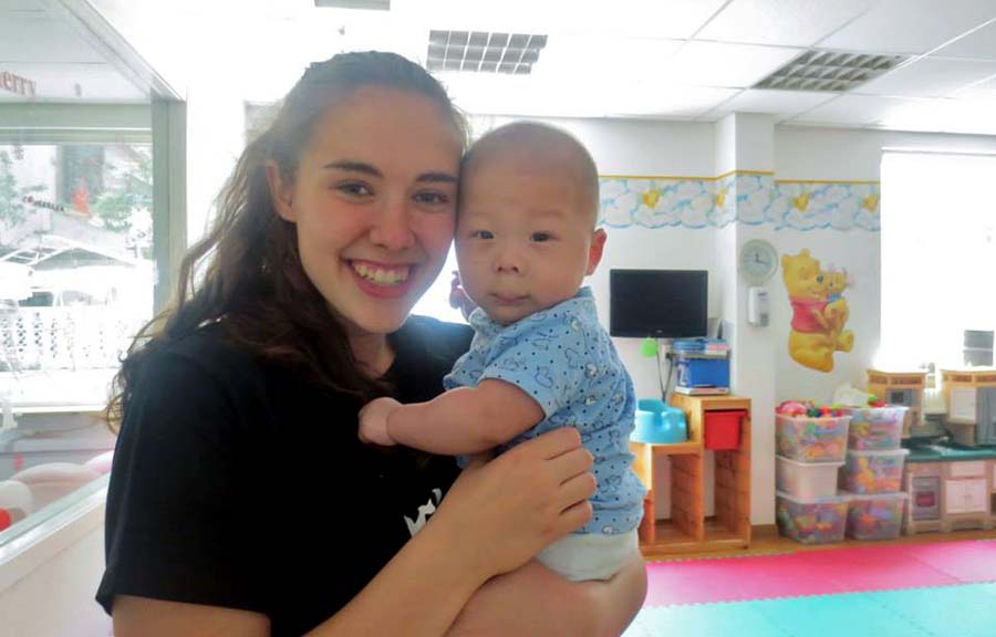 Emily Vincent at Chunmiao Little Flower with baby Yu in 2015.