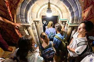 Several students wait to enter the shrine over the birthplace of Jesus in the Church of the Nativity in Bethlehem.