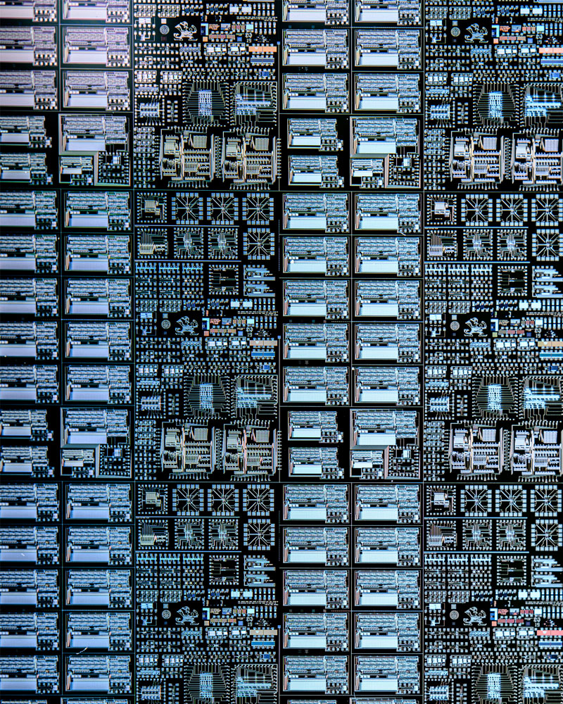 Close up image of a lot of microchips, showing the detail of the etched leprechaun.