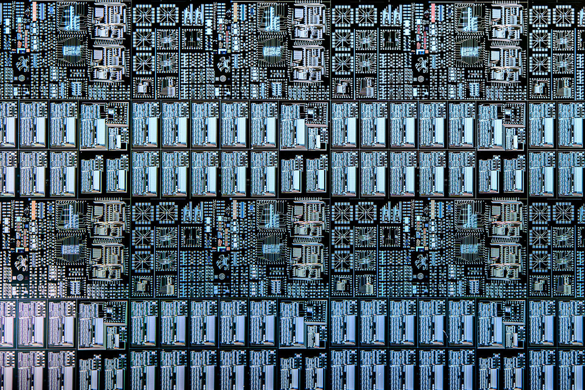 Close up image of a lot of microchips, showing the detail of the etched leprechaun.