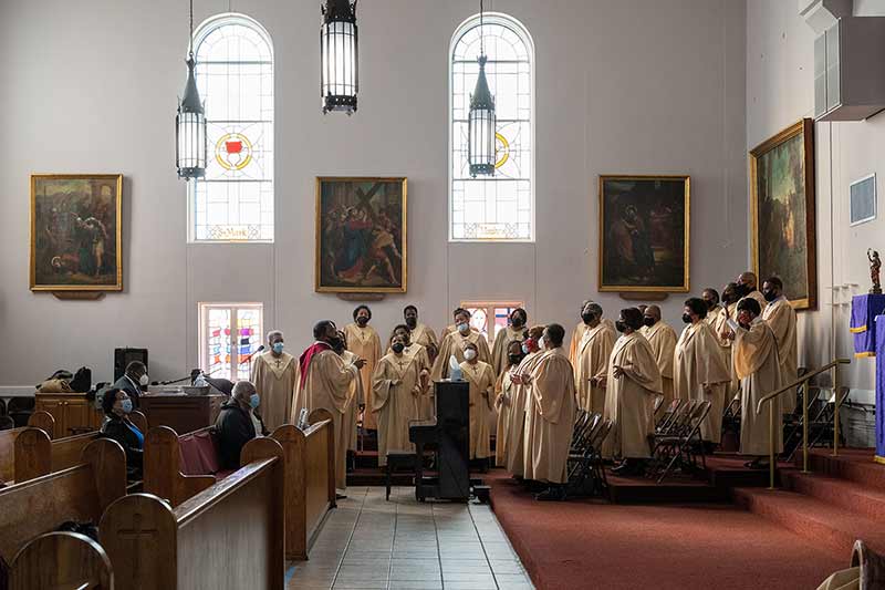 A church choir sings during mass.