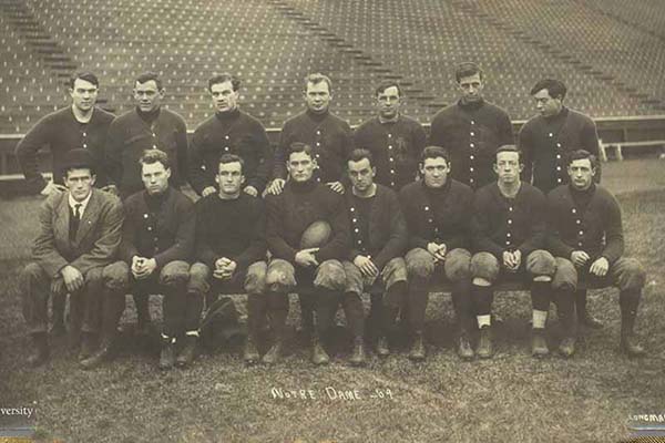 Sepia-toned photo of an old Notre Dame football team.