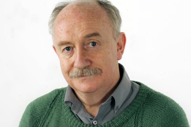 A man standing and speaking at a podium.