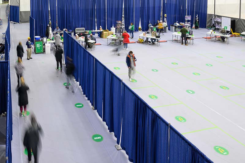 Aerial view of students participating in saliva surveillance testing.