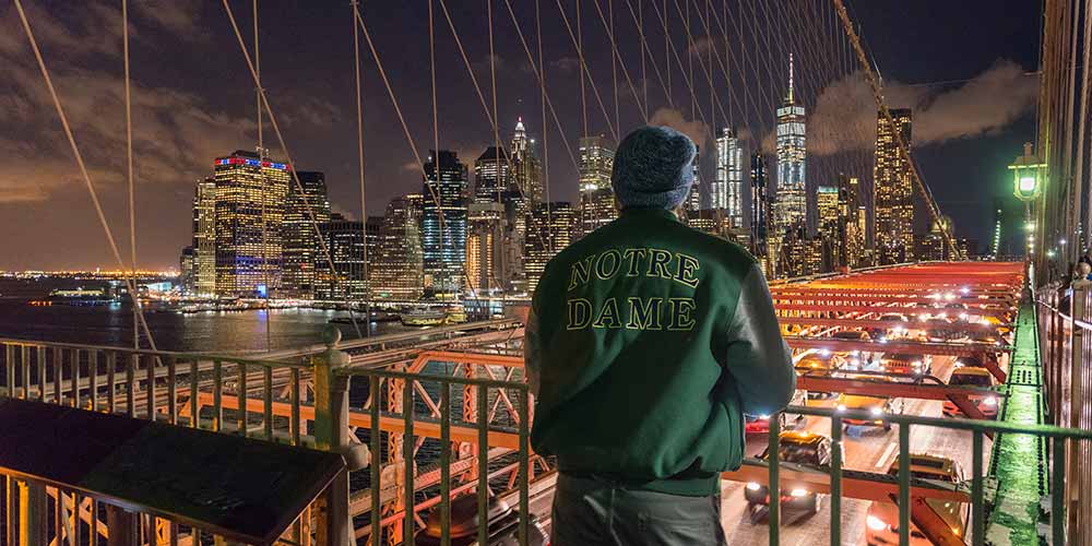 A junior civil engineering student, Adam Kuczynski, takes in the view of Manhattan from the Brooklyn Bridge.