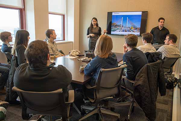 Students listen to HNTB presenter Allison Halpern and Patrick D'Ambrosio (right)  at the Empire State Building.