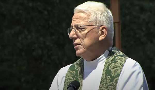A screengrab of Rev. Malloy giving his homily.