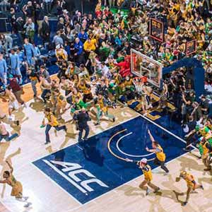 Feb 6, 2016; Students storm the court following the upset win over North Carolina. Notre Dame won 80-76. Photo by Matt Cashore)
