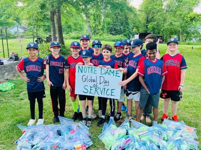 A group of boys shows all the toiletries they collected and organized into plastic bags.