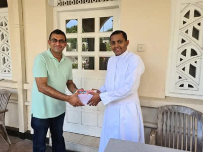 Two men holding documents.