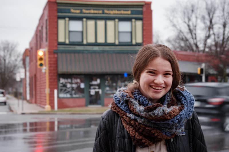 Notre Dame Student Monica Caponigro stands in front of a building in South Bend.