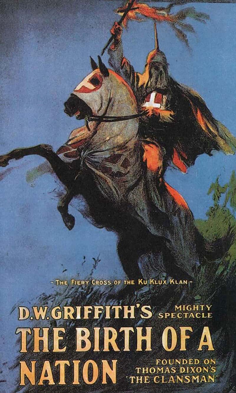 Movie poster for 'The Birth of a Nation' depicts a klansman holding a fiery cross while riding a robed horse.