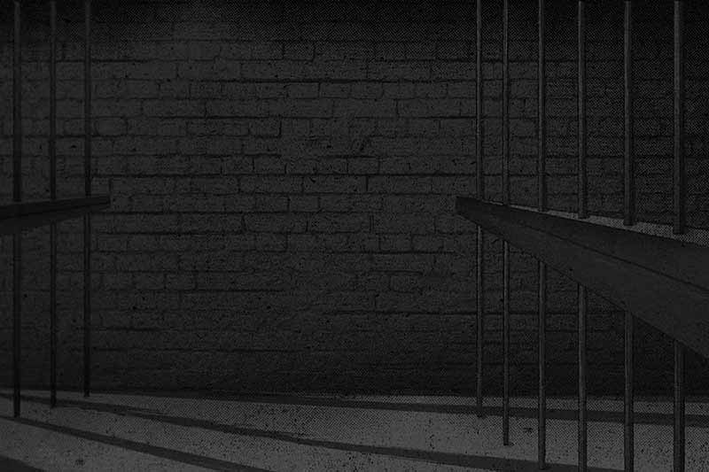 A grayscale illustration of a jail cell.
