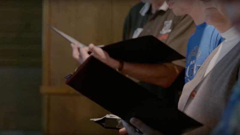 A close-up of sheet music folders