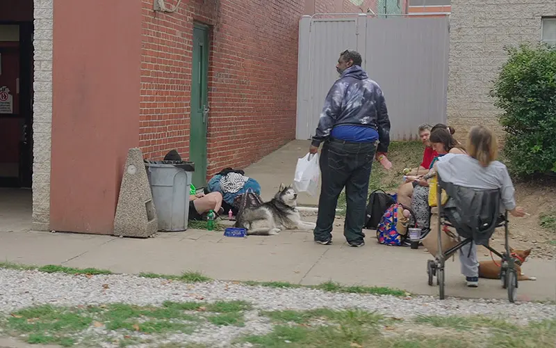 A group of people hang around the streets in Huntington, West Virginia.