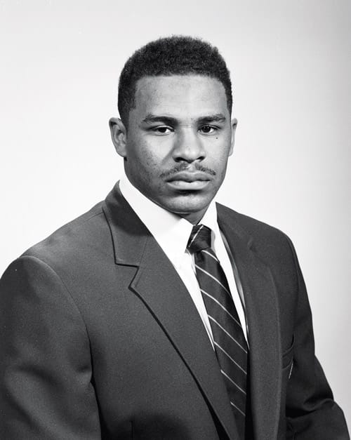 A black and white headshot of a younger Jerome Bettis.