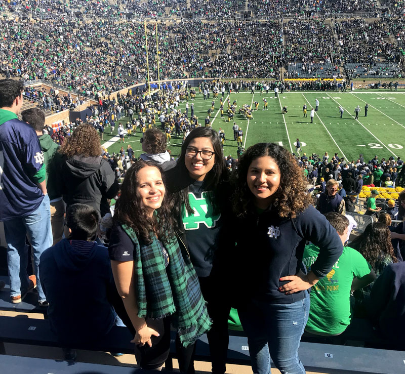 Karen and two friends pose for a picture in the stands at Notre Dame stadium.