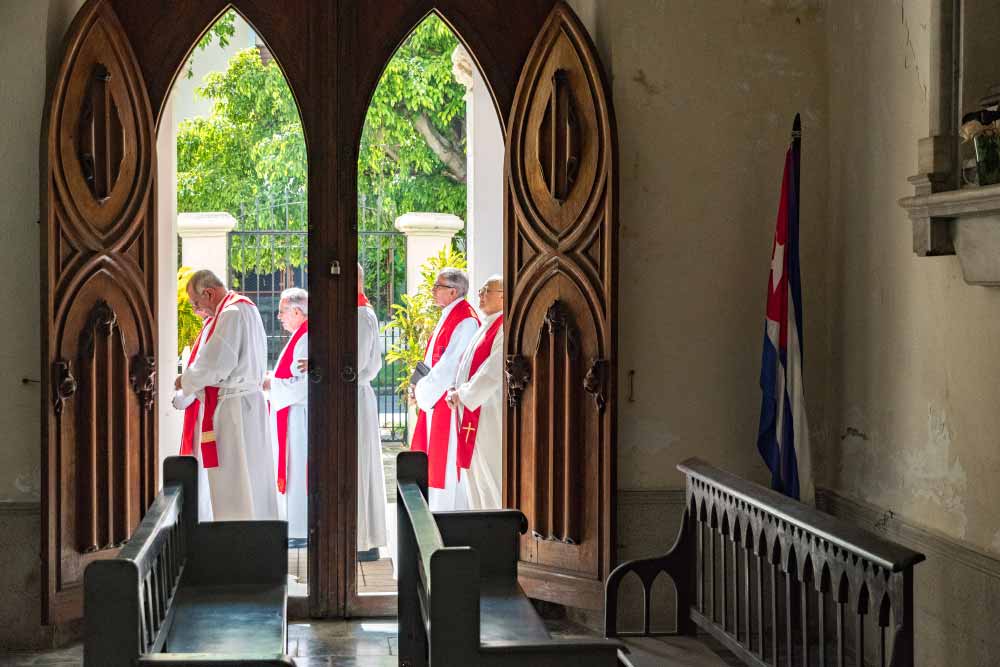 Cuban priests process into a mass celebrating the 80th birthday for Cardinal Jaime Ortega y Alamino.