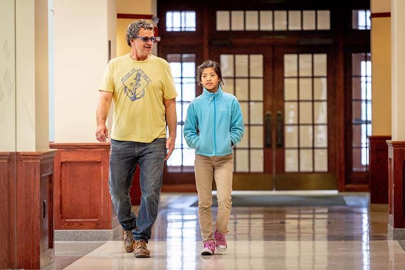 Tori arrives at Stinson Remick Hall with her father for final fitting of a pair of 3D-printed prosthetic hands.