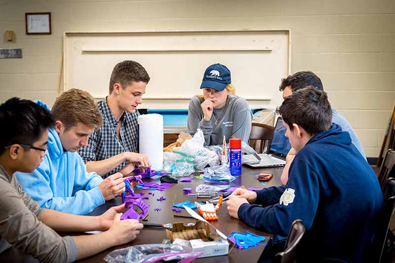 Members of the e-NABLE ND club meet and assemble the 3D-printed parts of the prosthetic hands.