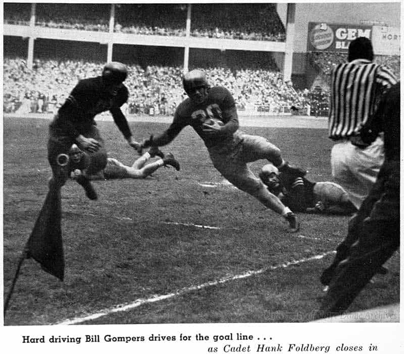 Football player running with the ball with caption 'Hard driving Bill Gompers drives for the goal line ... as Cadet Hank Foldberg closes in.'