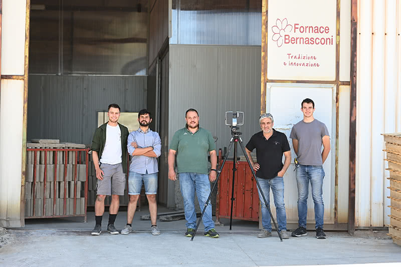 Bernasconi family and students standing outside of the Fornace Bernasconi business