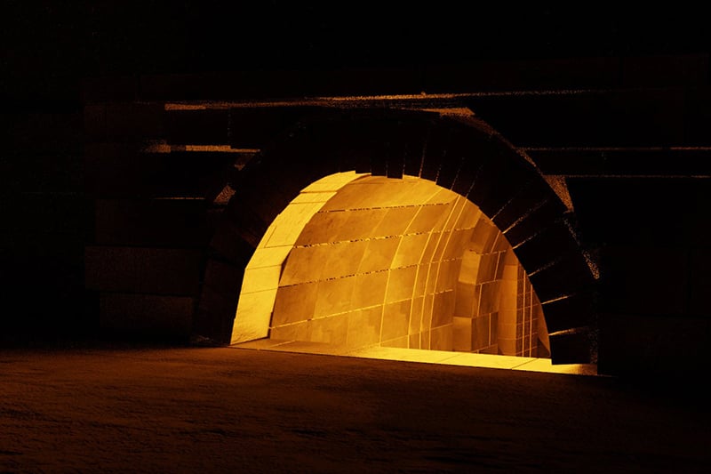 A brick kiln with flames inside
