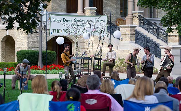 Six musicians performing outdoors for the Notre Dame’s Shakespeare Festival