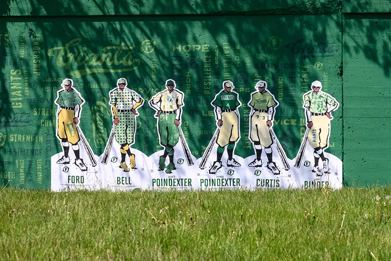 Mural of the Giants team of the 1920's on the wall surrounding the new field.