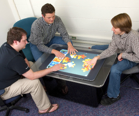 Students using a Microsoft Surface table