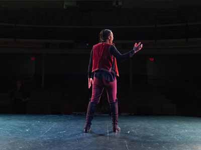 A student performs on stage