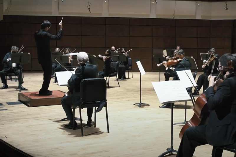 Alabama Symphony Orchestra on stage performing.